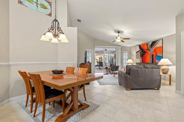 dining room featuring light tile patterned flooring, ceiling fan with notable chandelier, visible vents, baseboards, and vaulted ceiling