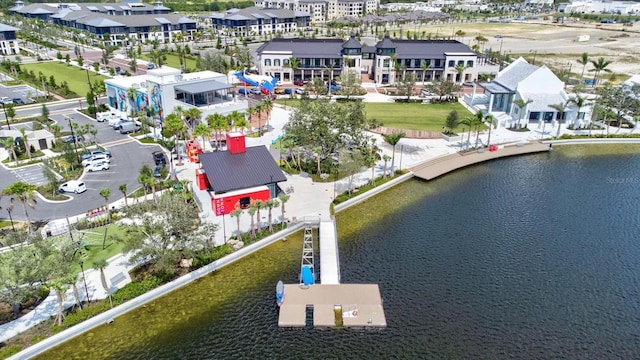 bird's eye view featuring a residential view and a water view