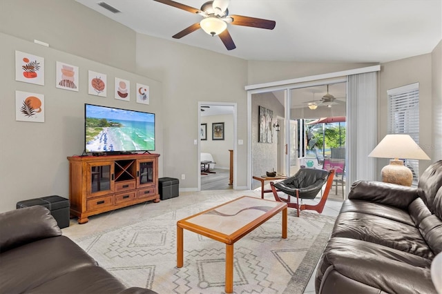 living area with light tile patterned floors, visible vents, vaulted ceiling, and a ceiling fan