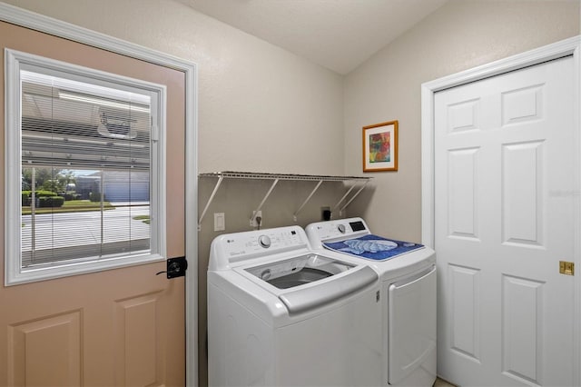 washroom featuring laundry area and washer and dryer