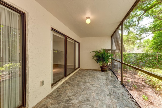 unfurnished sunroom with a wealth of natural light