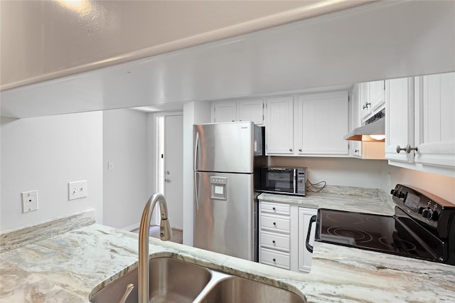 kitchen featuring light stone countertops, sink, white cabinetry, and black appliances