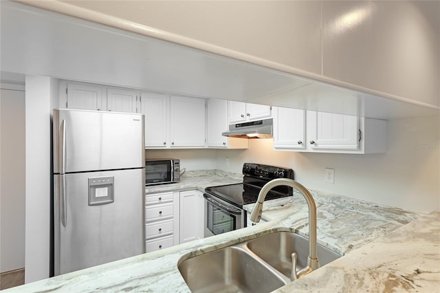 kitchen with sink, light stone counters, white cabinetry, and black appliances