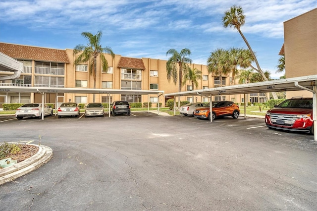 view of vehicle parking featuring a carport