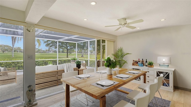 dining room with ceiling fan, light hardwood / wood-style floors, and a healthy amount of sunlight