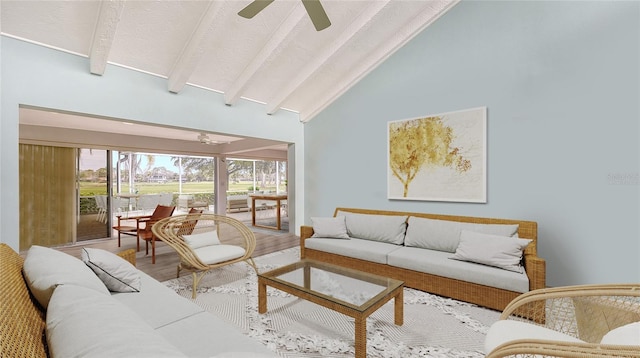 living room with beam ceiling, high vaulted ceiling, hardwood / wood-style floors, and ceiling fan