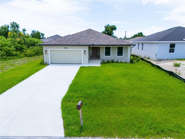 single story home with a front yard and a garage