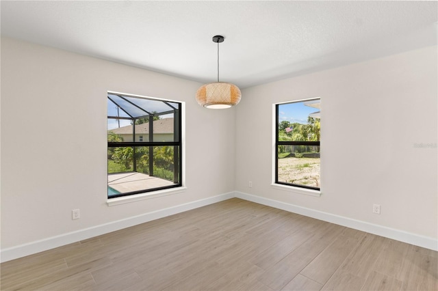 spare room with light wood-type flooring