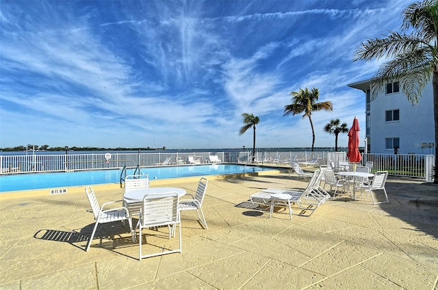 view of swimming pool featuring a patio