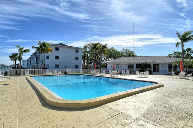 view of swimming pool featuring a patio area