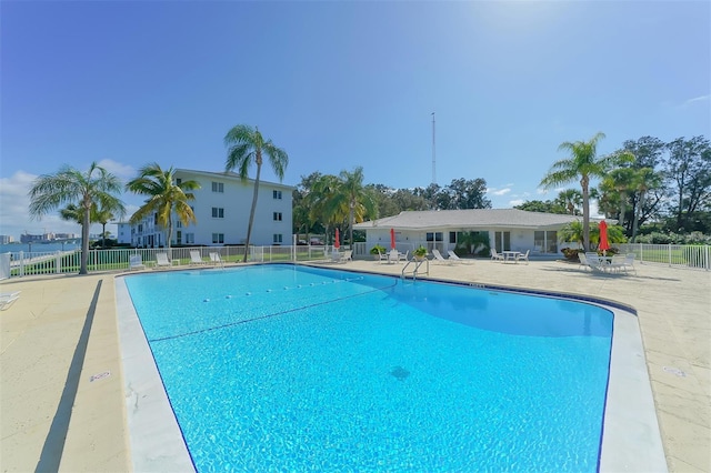 view of swimming pool with a patio