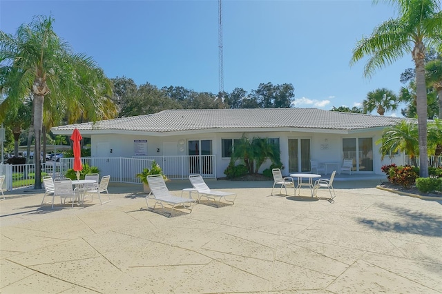 back of property featuring a patio area