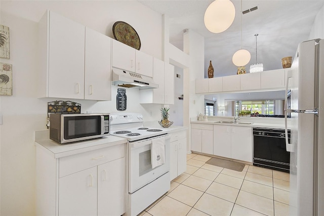 kitchen featuring a towering ceiling, white appliances, light tile patterned flooring, and white cabinets