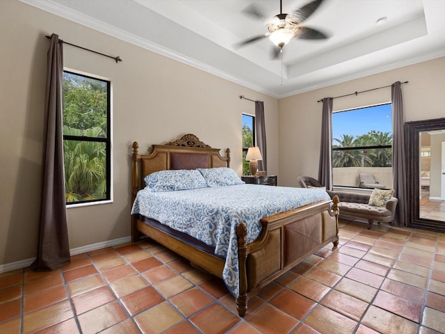 tiled bedroom with a raised ceiling, ceiling fan, and crown molding