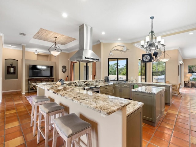 kitchen with island range hood, pendant lighting, a center island, a notable chandelier, and light tile flooring