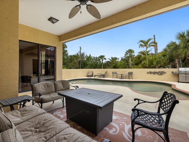 view of patio / terrace with a fenced in pool and ceiling fan