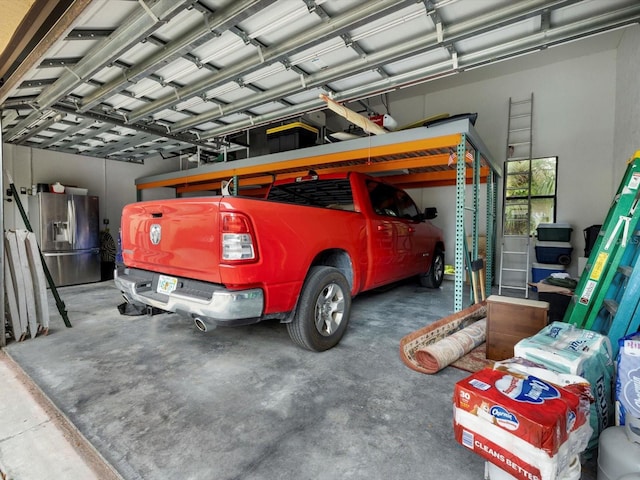 garage with stainless steel fridge