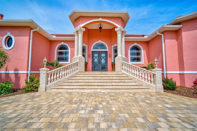 entrance to property featuring french doors