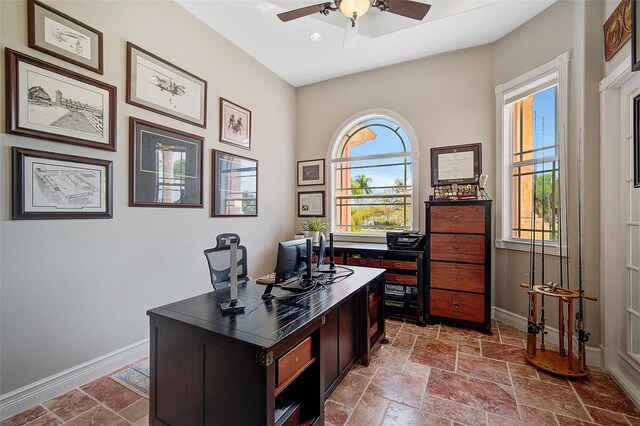 tiled office featuring ceiling fan and a wealth of natural light