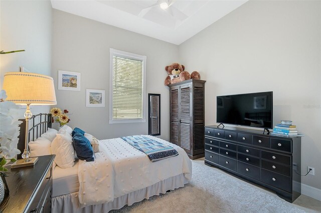 bedroom with light colored carpet and ceiling fan