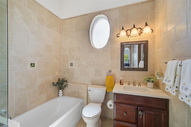 bathroom with oversized vanity, toilet, and tile walls