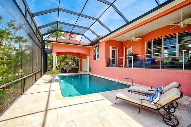 view of pool with a patio area, an outdoor living space, ceiling fan, and glass enclosure