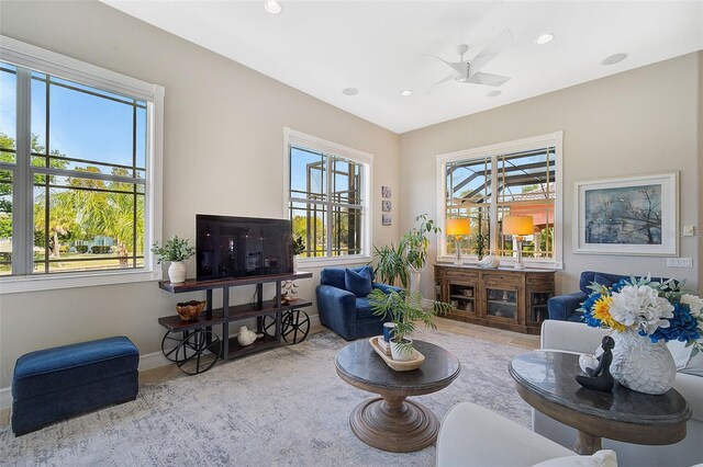 living room with ceiling fan and light tile floors