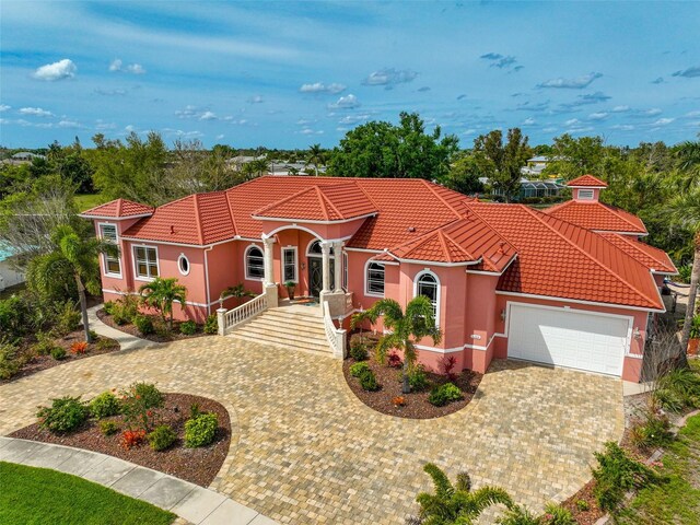 mediterranean / spanish house featuring a garage