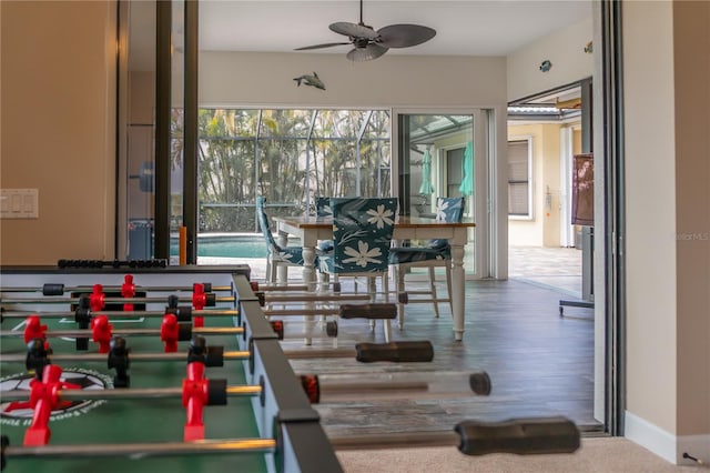 rec room featuring hardwood / wood-style floors and ceiling fan