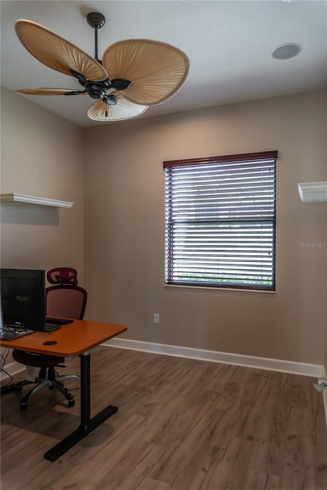 office area with wood-type flooring and ceiling fan