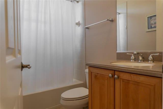 full bathroom featuring vanity, toilet, and shower / bathtub combination with curtain