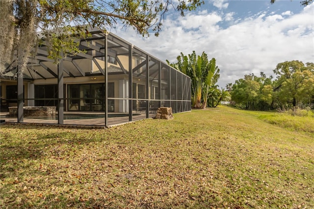 view of yard featuring a patio area, glass enclosure, and a pool