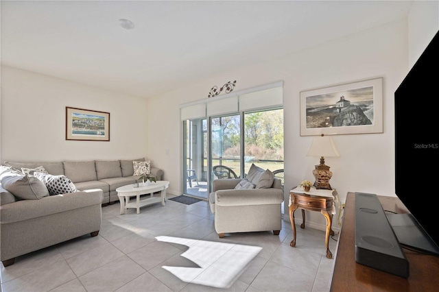 living room featuring light tile floors