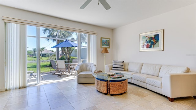 living room featuring light tile floors and ceiling fan