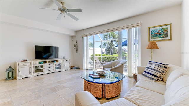 living room with ceiling fan and light tile flooring