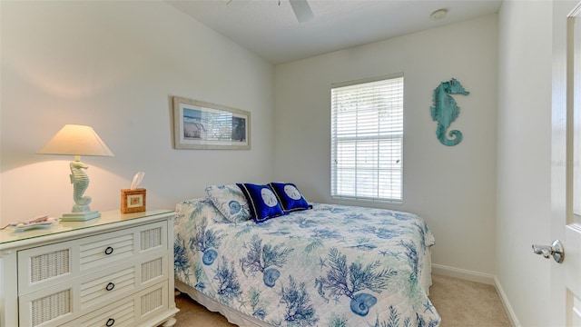 bedroom with light carpet and ceiling fan