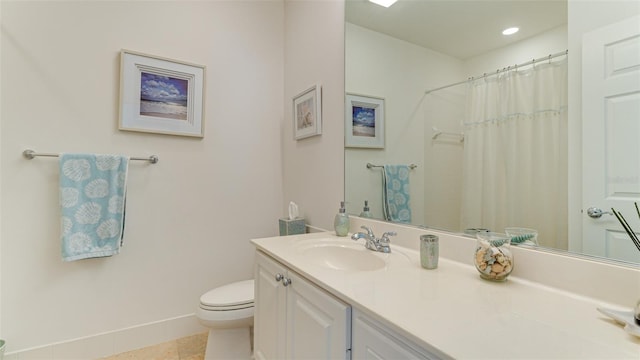 bathroom with toilet, tile flooring, and vanity