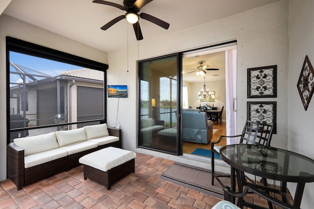 exterior space with an outdoor living space and ceiling fan