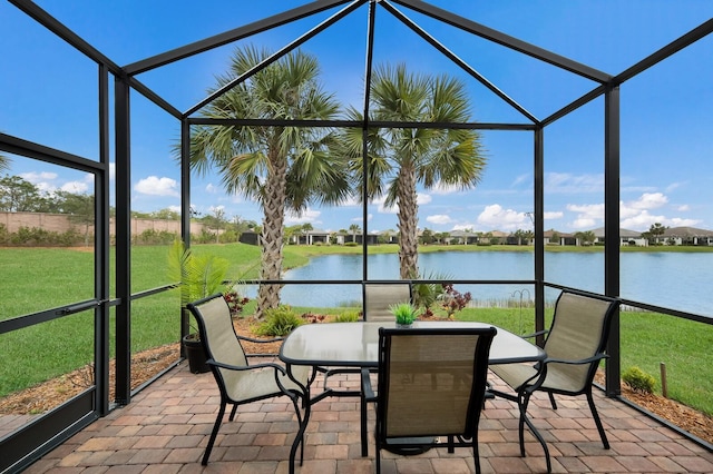 unfurnished sunroom with a water view