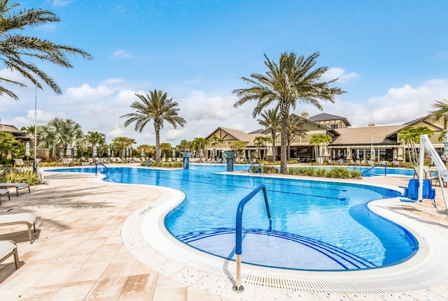 view of swimming pool featuring a patio area