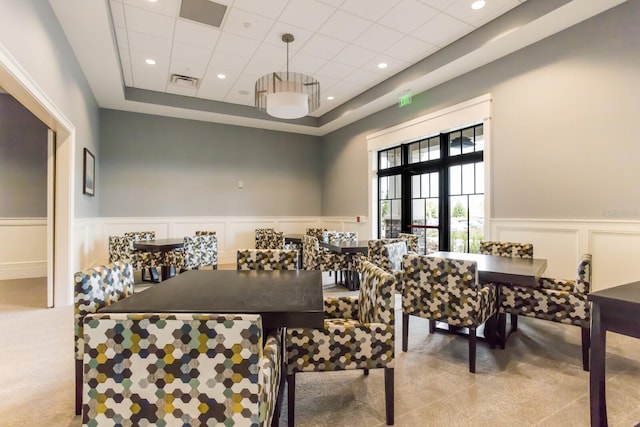 dining area featuring a paneled ceiling