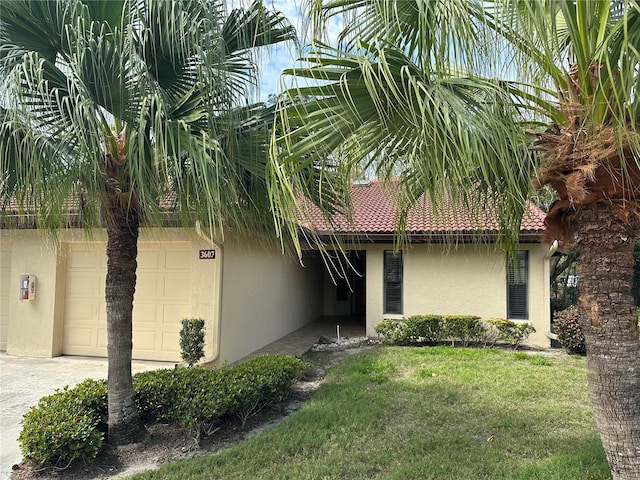 exterior space featuring a yard and a garage