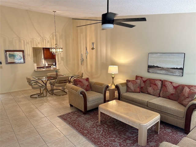 living room featuring ceiling fan with notable chandelier, sink, light tile floors, a textured ceiling, and vaulted ceiling