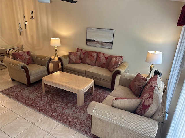 tiled living room featuring ceiling fan