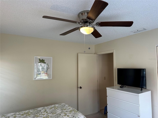 bedroom featuring a textured ceiling and ceiling fan