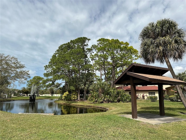 exterior space with a water view and a yard