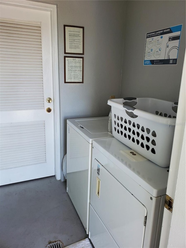 washroom with washing machine and clothes dryer