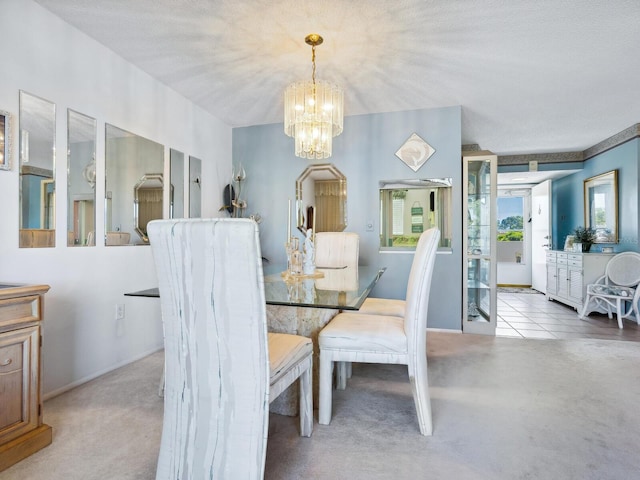 dining space with light carpet and a chandelier