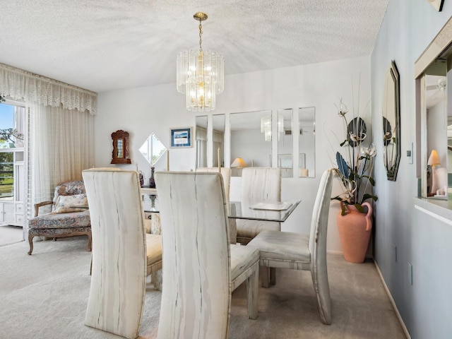 dining room with a textured ceiling, light carpet, and a chandelier