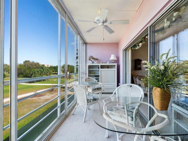 sunroom / solarium with ceiling fan